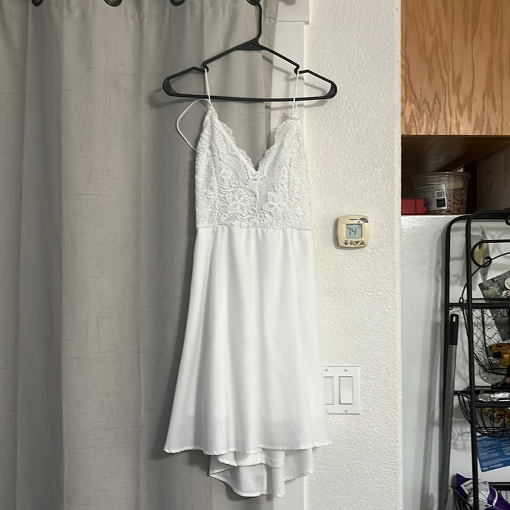 White mini dress with lace on top.